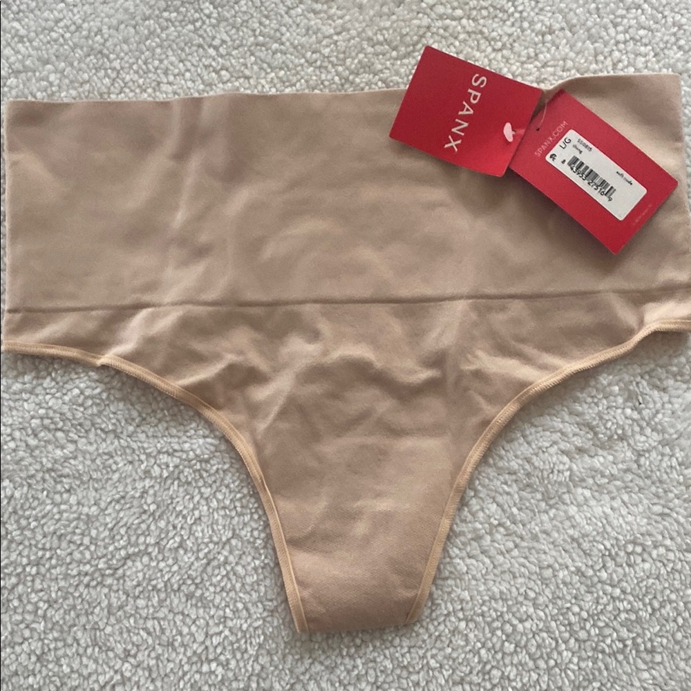 SPANX High-Waisted Thong in Beige and Black Available in sizes L and XL.